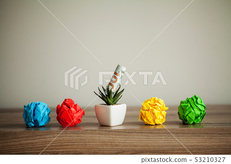 Creative idea concept. Crumpled paper balls on wood background Creative idea concept. Crumpled paper balls on wood background 53210327