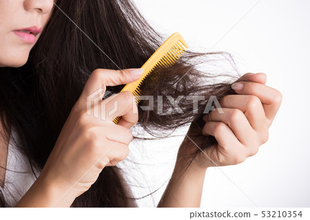 Healthy concept. Woman show her brush with damaged Healthy concept. Woman show her brush with damaged 53210354