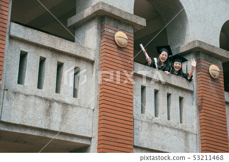 students look down waving hand showing diploma students look down waving hand showing diploma 53211468