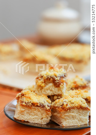 Sweet sand tart with apricot jam. Cut into pieces, 53214775