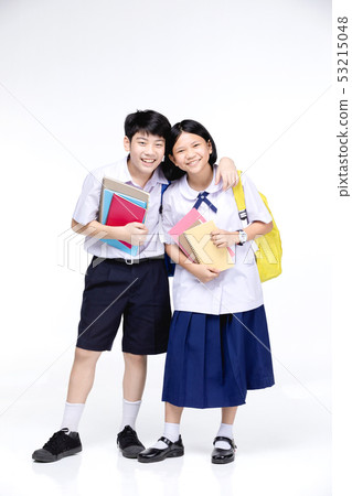 Two asian smiling school kids with colorful Two asian smiling school kids with colorful 53215048