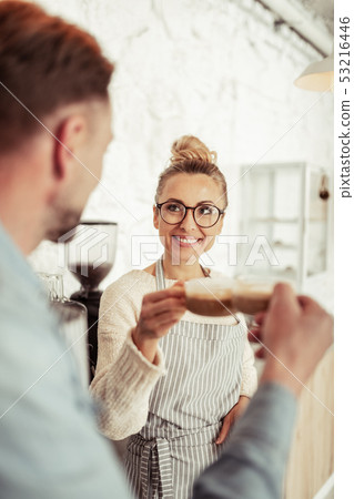 Beautiful woman drinking coffee with her husband. Beautiful woman drinking coffee with her husband. 53216446