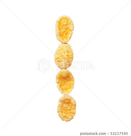 Yellow cornflakes letter I isolated on white background. Alphabet cereal flakes. Yellow cornflakes letter I isolated on white background. Alphabet cereal flakes. 53217593