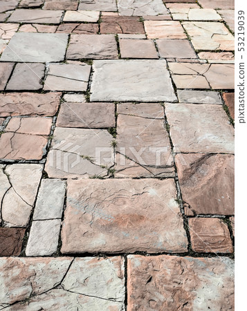 Light brown ancient stone road close up. Light brown ancient stone road close up. 53219039