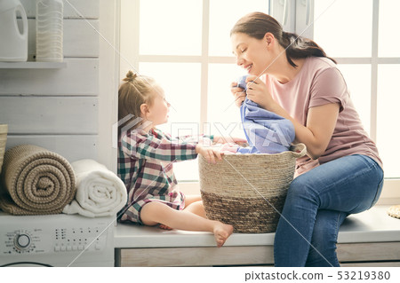 family doing laundry family doing laundry 53219380