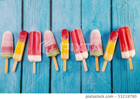 Ice cream stick placed on a blue vintage wooden Ice cream stick placed on a blue vintage wooden 53219780