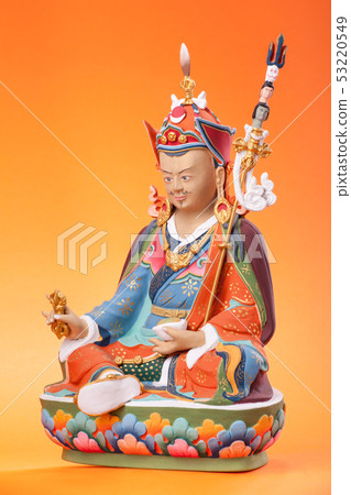 Figurine of Guru Rinpoche on an orange background. Figurine of Guru Rinpoche on an orange background. 53220549