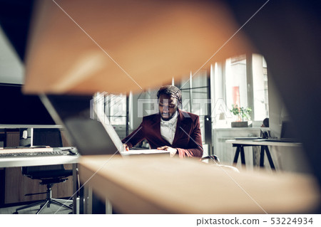 Handsome dark-skinned businessman working in the office 53224934