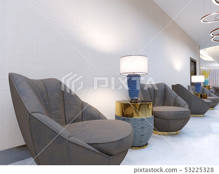 A modern reception area with large upholstered 53225328