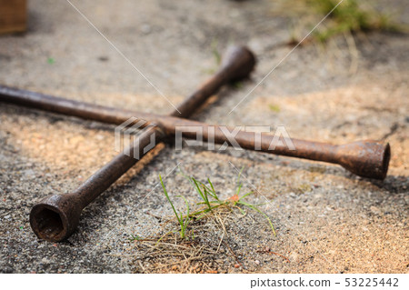 Manual socket wheel wrench lying on ground 53225442