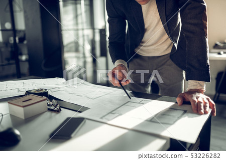 Interior designer drawing some sketches of apartment 53226282