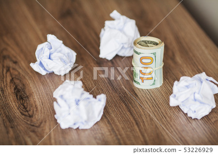 Great idea concept. Crumpled colorful paper on wooden table Great idea concept. Crumpled colorful paper on wooden table 53226929