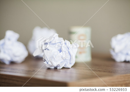 Great idea concept. Crumpled colorful paper on wooden table Great idea concept. Crumpled colorful paper on wooden table 53226933