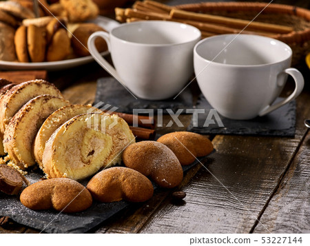 Cookies heart shape, sand rolled biscuit and cinnamon stick Cookies heart shape, sand rolled biscuit and cinnamon stick 53227144