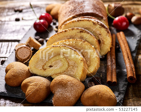 Cookies heart shape, sand rolled biscuit and cinnamon stick Cookies heart shape, sand rolled biscuit and cinnamon stick 53227145