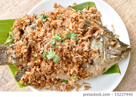 batter fried mango fish topping chop garlic batter fried mango fish topping chop garlic 53227440