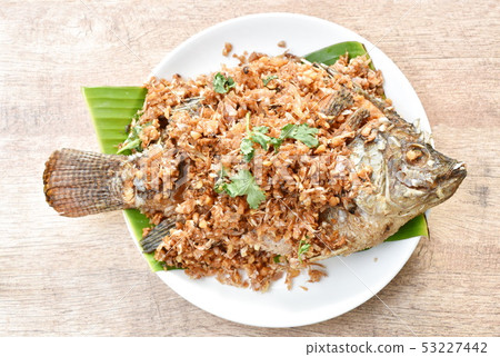 batter fried mango fish topping chop garlic batter fried mango fish topping chop garlic 53227442