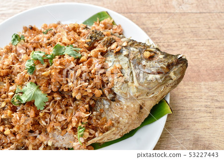 batter fried mango fish topping chop garlic batter fried mango fish topping chop garlic 53227443