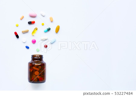 Colorful tablets with capsules and pills on white. 53227484