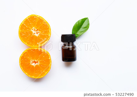 Essential oil with fresh orange citrus fruit on Essential oil with fresh orange citrus fruit on 53227490