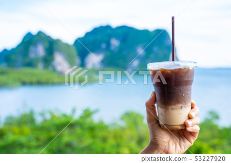 caramel macchiato in plastic glass caramel macchiato in plastic glass 53227920