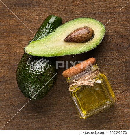 Fresh avocado and oil in jar Fresh avocado and oil in jar 53229370