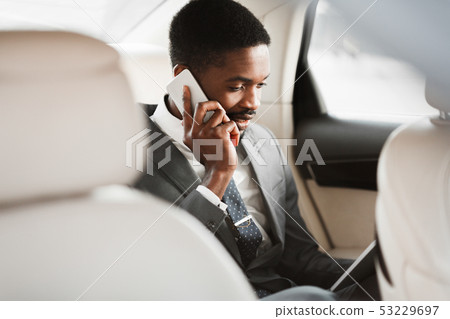 Always Available. Businessman Having Business Talk In Car Always Available. Businessman Having Business Talk In Car 53229697