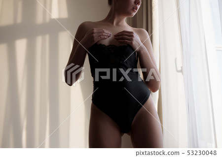 Young sensual naked woman posing in room Young sensual naked woman posing in room 53230048