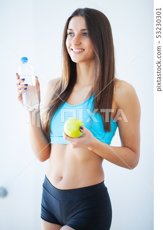 Diet and Drinking Water. Woman with bottle of water Diet and Drinking Water. Woman with bottle of water 53230301