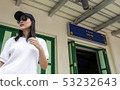 Beautiful smile Asia sunglass girl lady tour wait  53232643