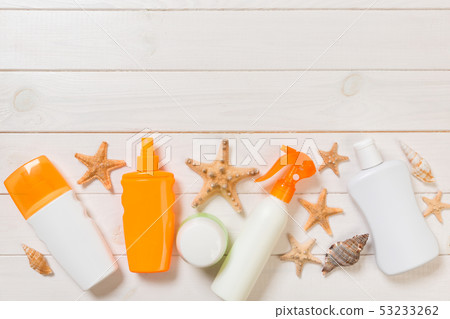 beach accessories on a wooden background top view 53233262
