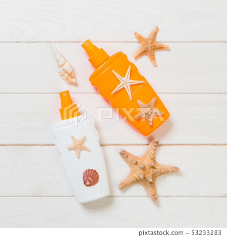 beach accessories on a wooden background top view 53233283