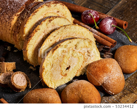 Sand cookies heart shape, rolled cake with cherry, cinnamon stick Sand cookies heart shape, rolled cake with cherry, cinnamon stick 53234412