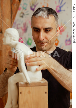 sculptor at work sculptor at work 53234947