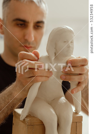 sculptor at work 53234958