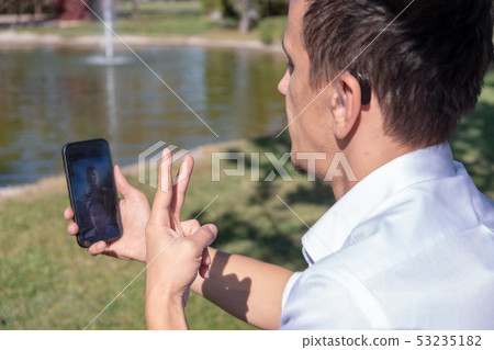 Young boy communicating with sign language Young boy communicating with sign language 53235182