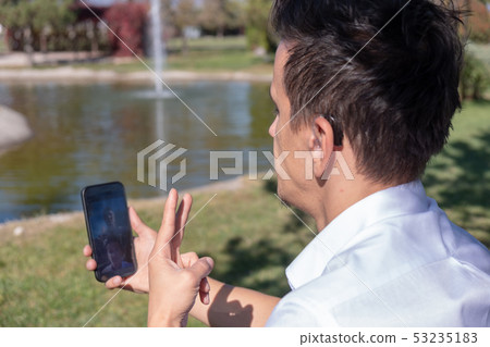 Young boy communicating with sign language Young boy communicating with sign language 53235183
