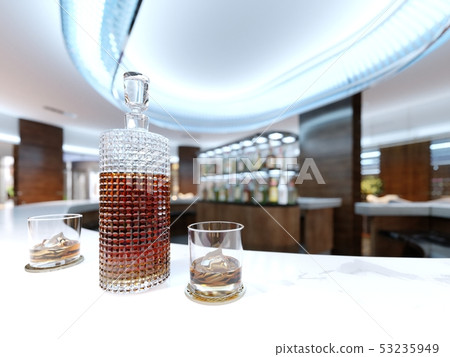 A decanter with alcohol and two glasses on a white A decanter with alcohol and two glasses on a white 53235949