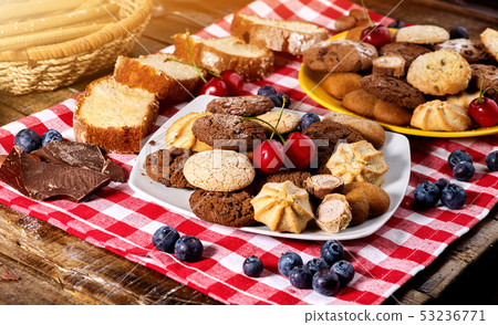 Oatmeal Cookies and sand chocolate cake with blueberries sun flare 53236771