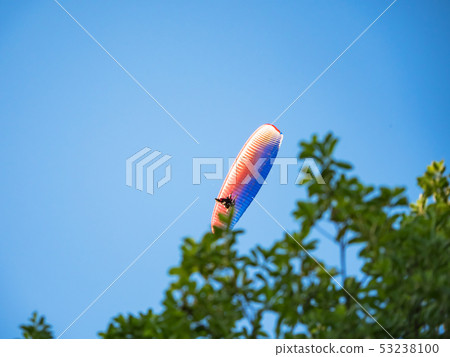 Powered parachute against the blue sky. Powered parachute against the blue sky. 53238100