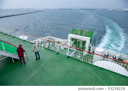 Tsugaru Strait Ferry just after leaving Aomori Port Mother and daughter looking at the shore of Blue Dolphin Tsugaru Strait Ferry just after leaving Aomori Port Mother and daughter looking at the shore of Blue Dolphin 53239229