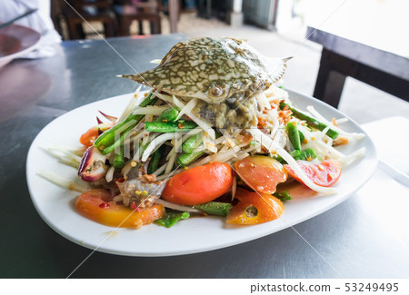 Spicy papaya salad with raw blue crab 53249495