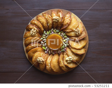 Qatayef, Arabic sweets for Ramadan. Fried Qatayef 53251211