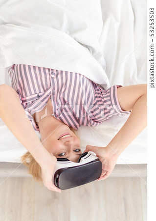 smiling cheerful girl with VR headset posing to the camera 53253503