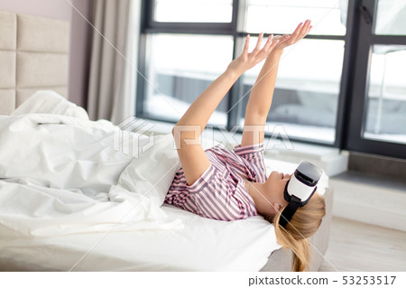 power of technology. funny girl using a virtual goggles 53253517