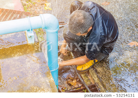 plumber working repair the broken pipe and replace 53254131