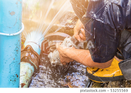 plumber working repair the broken pipe and replace plumber working repair the broken pipe and replace 53255569
