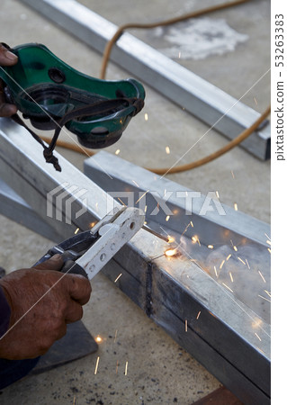The welders are welding steel in the factory The welders are welding steel in the factory 53263383