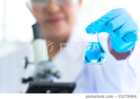 Female scientist hold and showing laboratory test Female scientist hold and showing laboratory test 53276904