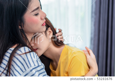 Close up of two Asian Lesbian women embracing 53281676